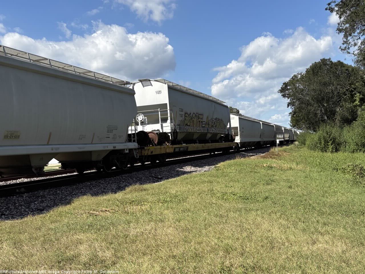 CCBX 71837 damaged and loaded on flat